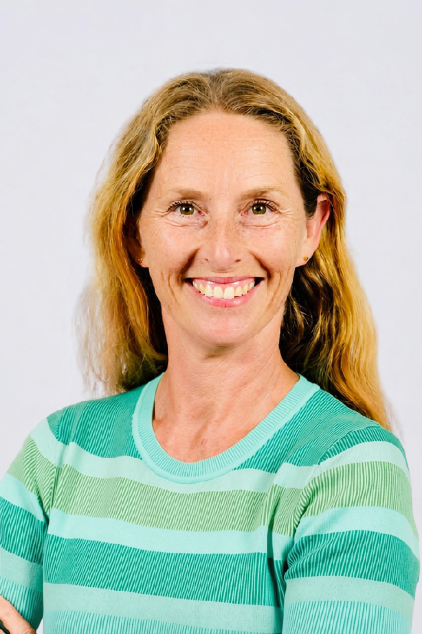 Natasha Cromer, founder of Seedwell, smiling against a pale blue background